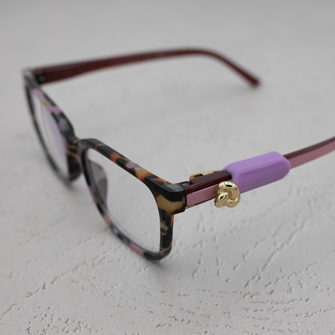 ALTACHÉ Gold Knot Eyewear Charm (Includes Black/Brown Sleeves)